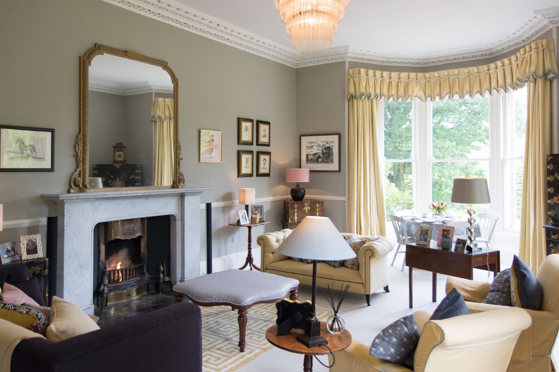 Elegant sitting area with fireplace and bay window