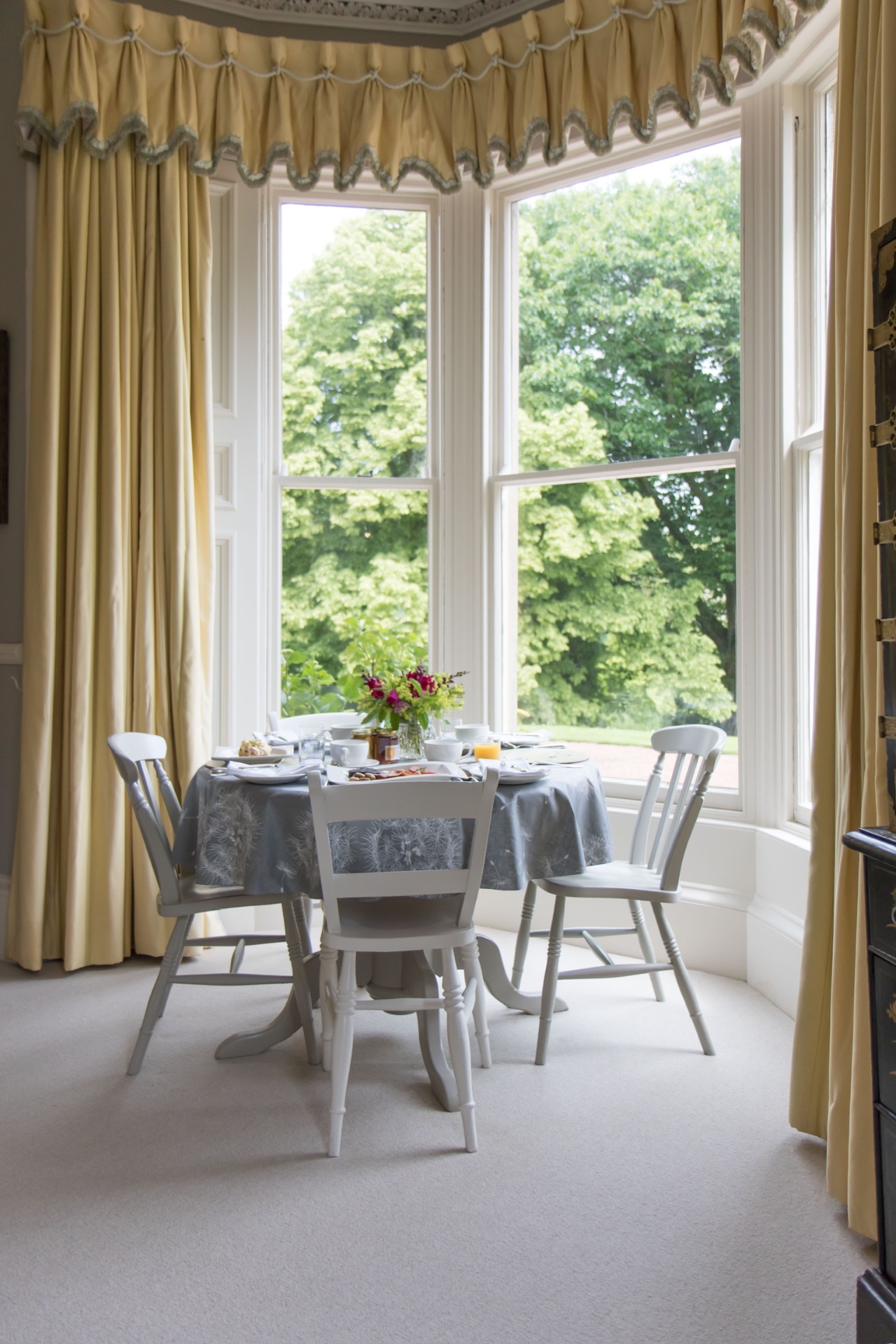 Breakfast table set at the bay window