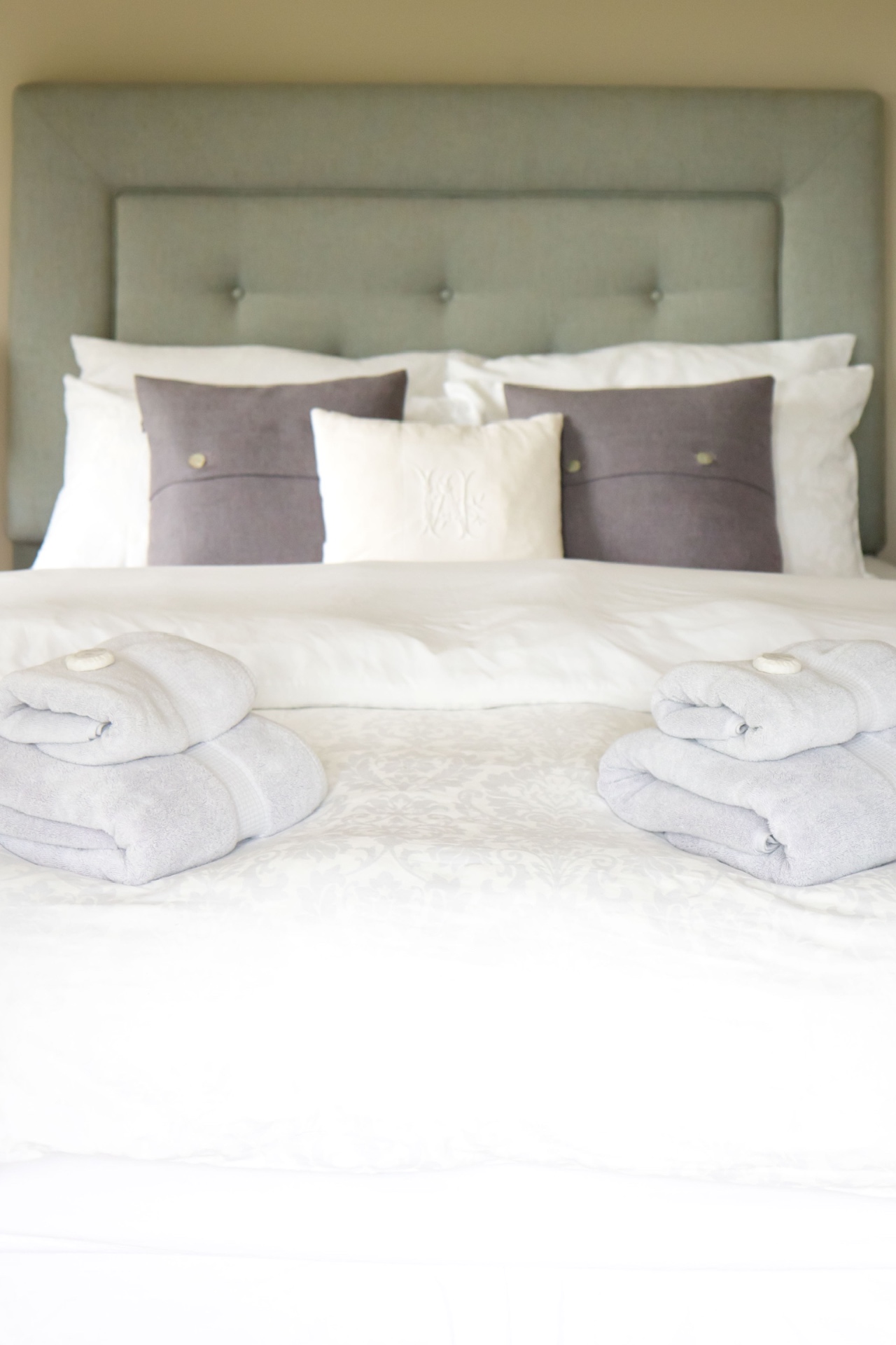 Bed with fresh towels and linen